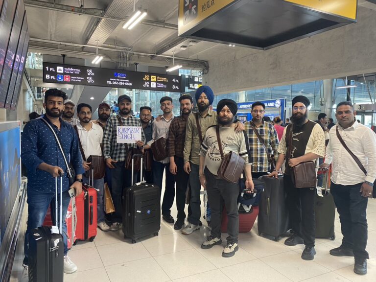 A big group with their suitcases at the airport
